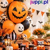 Bukiet balonów na Halloween — foliowa dynia i balony z buziami dyni nad stołem nakrytym na przyjęcie